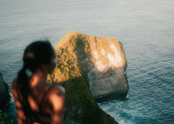 Girl posing in front of Nusa Penida, Indonesia