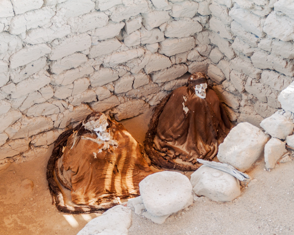 Weird Attractions - Preserved mummies sitting up at Chauchilla Cemetery, Peru