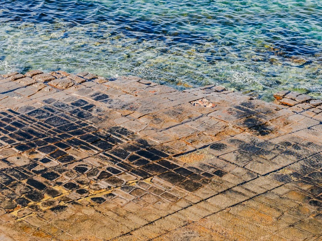 The Tessellated Pavement near Hobart with geometric rock formations at the shoreline