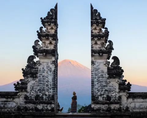 Woman standing in front of temple in Indonesia